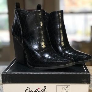 Women’s black croc boots.